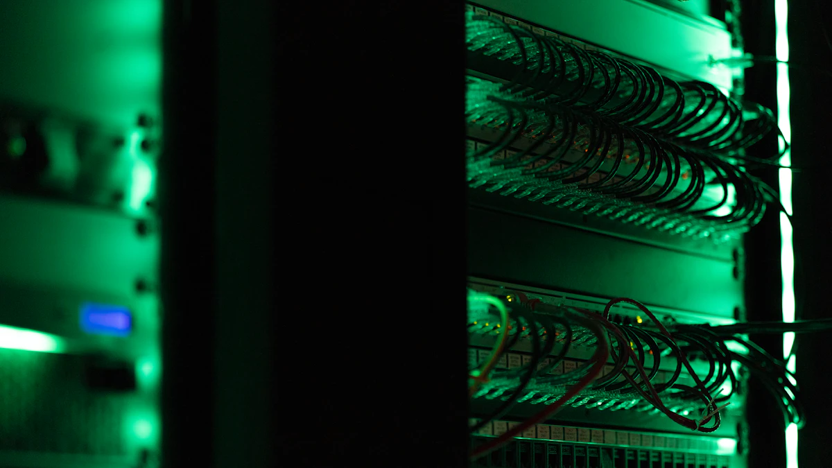 Network cables connected to a server rack under green light
